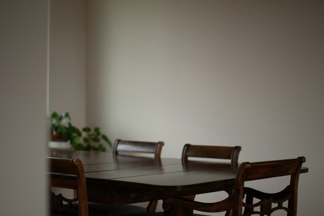 An empty dining table and chairs at home.